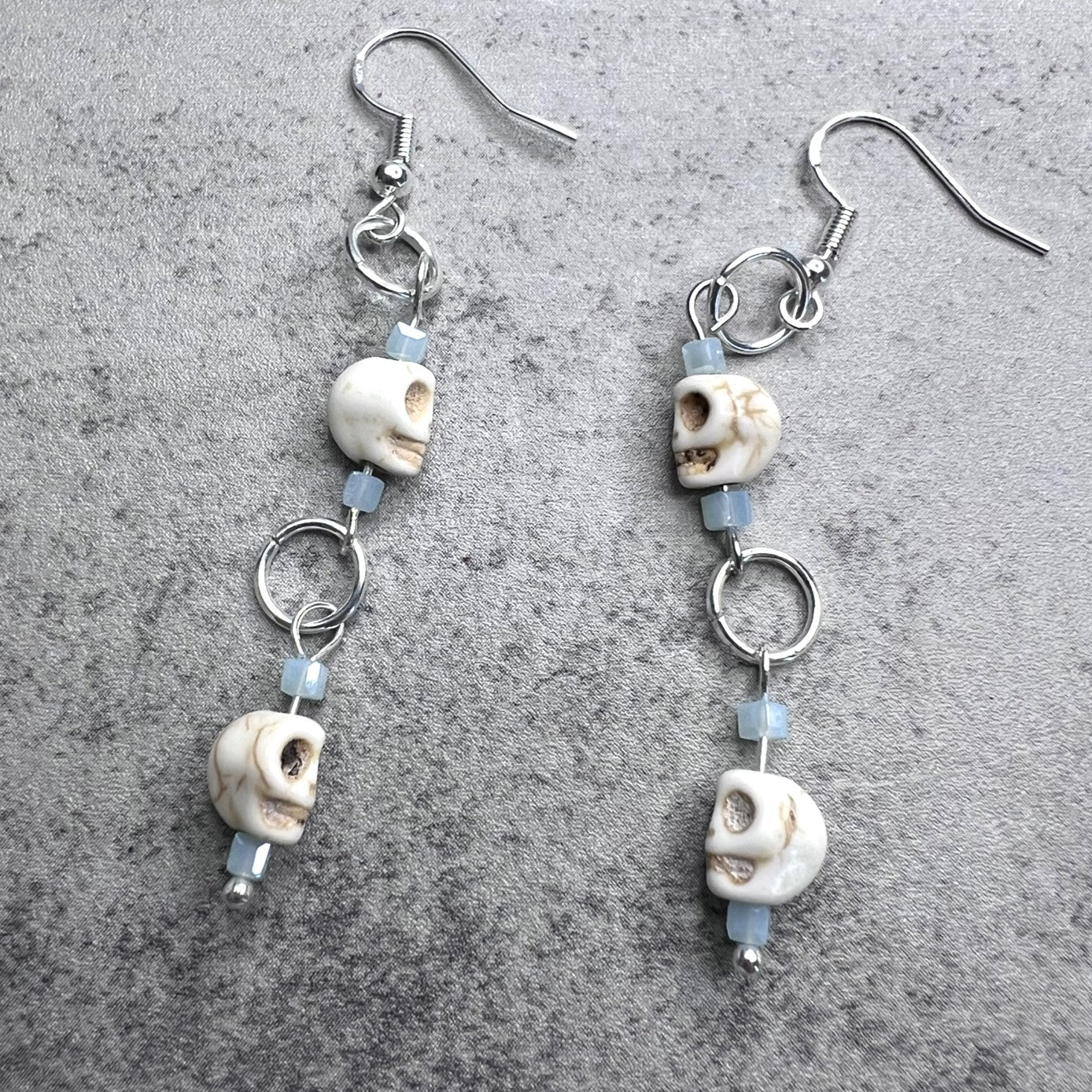 Silver Tone Skull Dangle Earrings with Blue Glass Square Beads